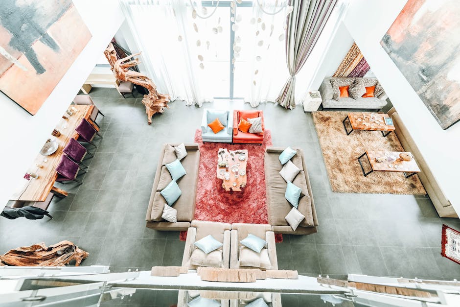 Bright, spacious living room with contemporary design, featuring cozy sofas and vibrant decor elements.