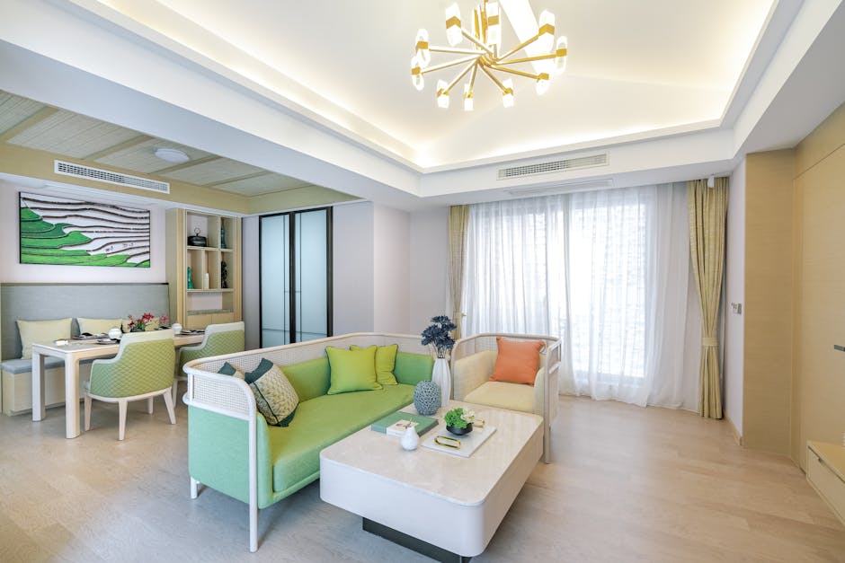 Spacious living room with vibrant furniture and chic design, exuding elegance.