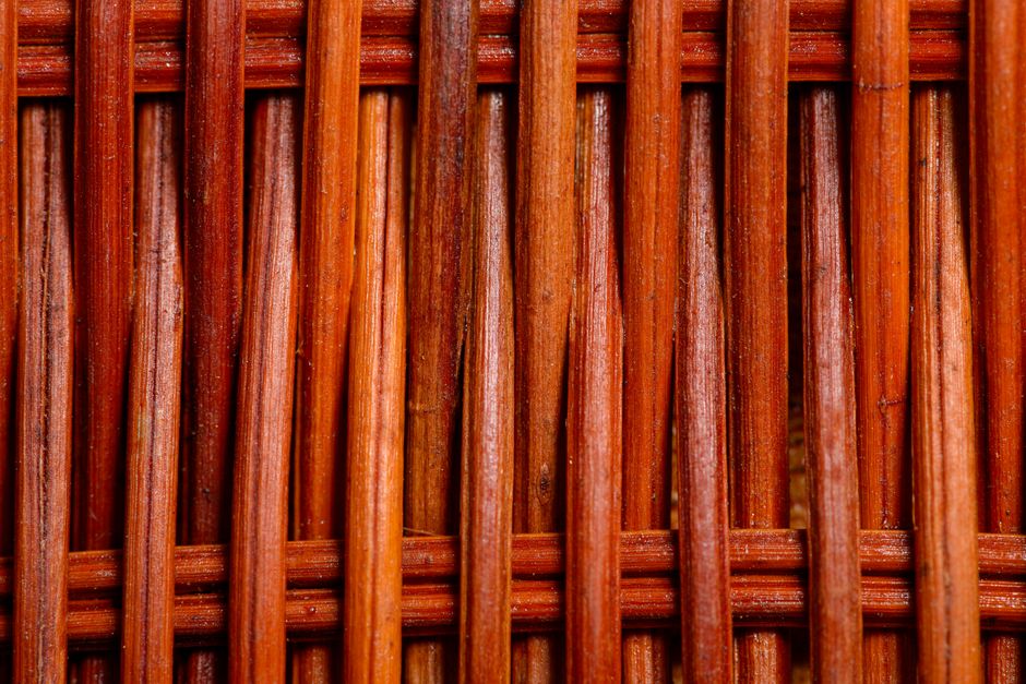 Detailed view of a woven wooden texture showcasing intricate pattern and craftsmanship.