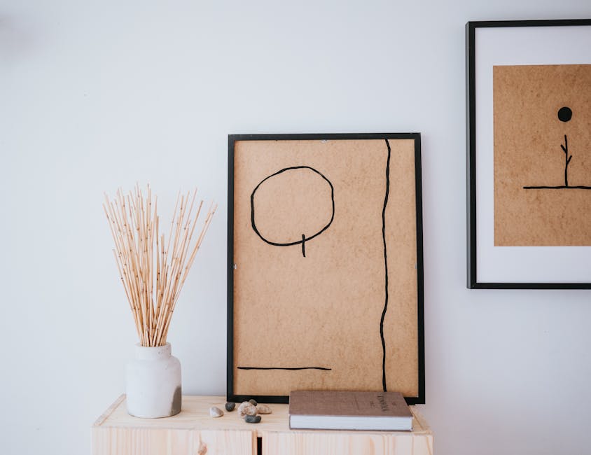 Elegant Japandi-style room with minimalist art, vases, and natural decor.