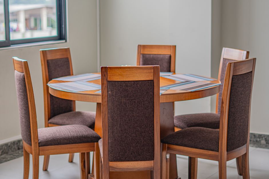 A stylish wooden dining table with chairs in a modern room in Ecuador.