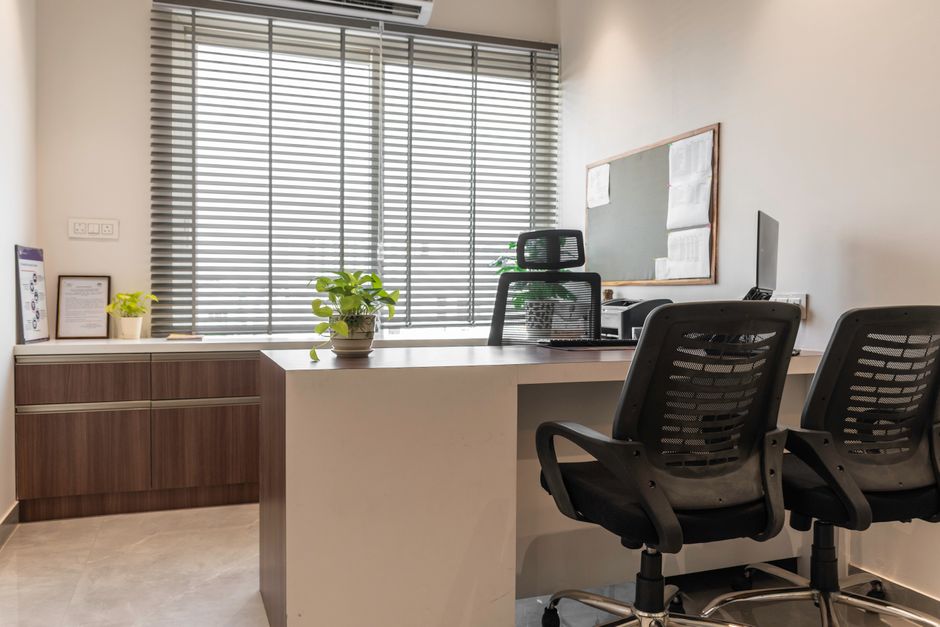 A bright and contemporary office space with natural lighting and modern furniture.