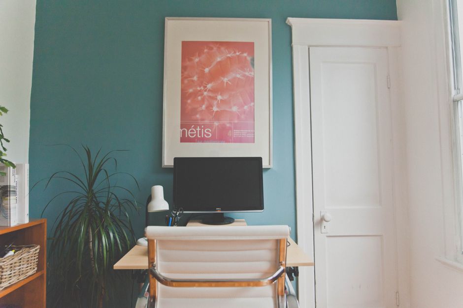 Contemporary home office setup with desk, chair, and decor elements in a minimalist design.